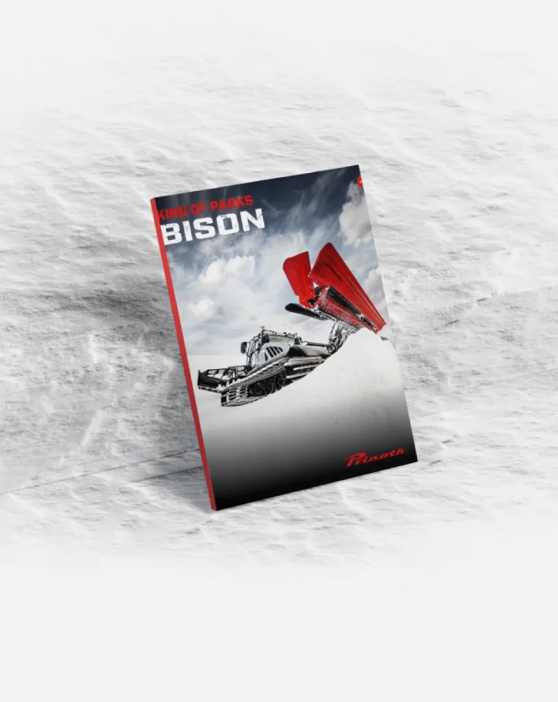 Bison katalog på snø med ulv foran